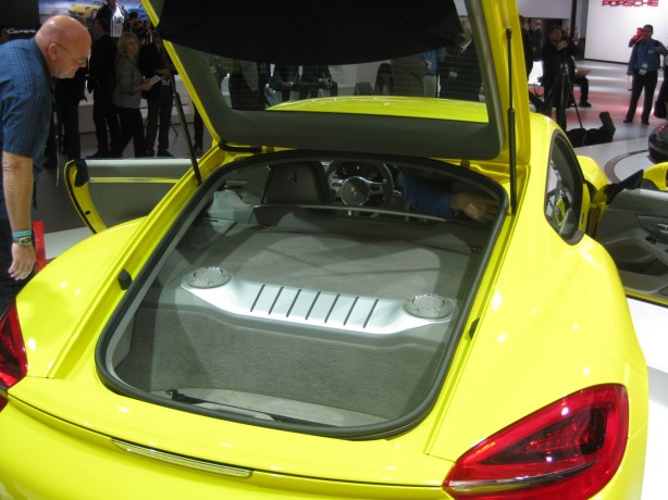 That big lump in the back of the 2013 Cayman S is the engine cover. Like the Boxster, the Cayman has a mid-mount engine which makes it the best handling Porsche. Just don't say that to the Germans at the show as they will always tell you that the 911 is the best. All the car magazines say otherwise.