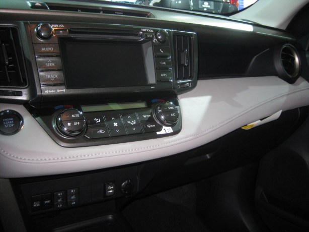 The RAV4's dash has many horizontal layers that I think work. The center controls are easy to reach and mix both hard knobs and buttons with some functions on the touch screen.