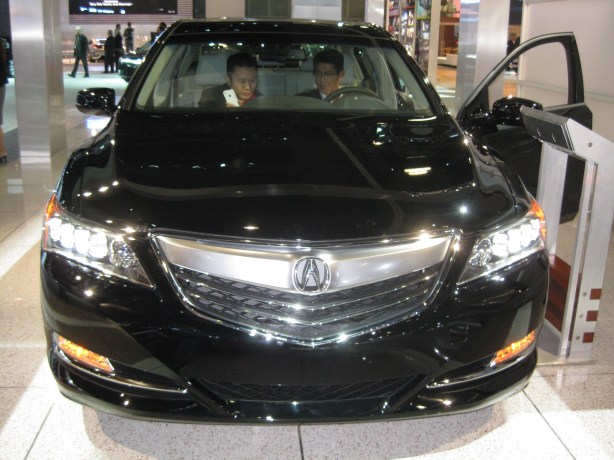 2014 Acura RLX with its blazing LED headlights.