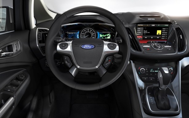 The cockpit of the 2013 Ford C-Max Hybrid. It bears more than a passing resemblance to the Ford Focus, which serves as the basis for the C-Max.