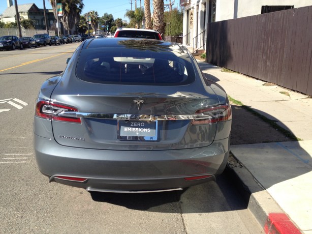 Another new Tesla Model S is able to find a coveted street parking space on Abbot Kinney in Venice.