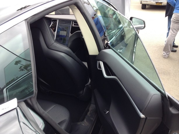 The rear doors are slim and attractive. The windows are frameless. Although it was a bit of a squeeze to get in due to the heavily-raked roof line, there was plenty of room due to the flat floors and lack of a transmission tunnel. 