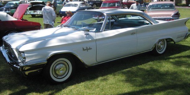 I believe this is a 1958 Chrysler New Yorker. Love the fins.