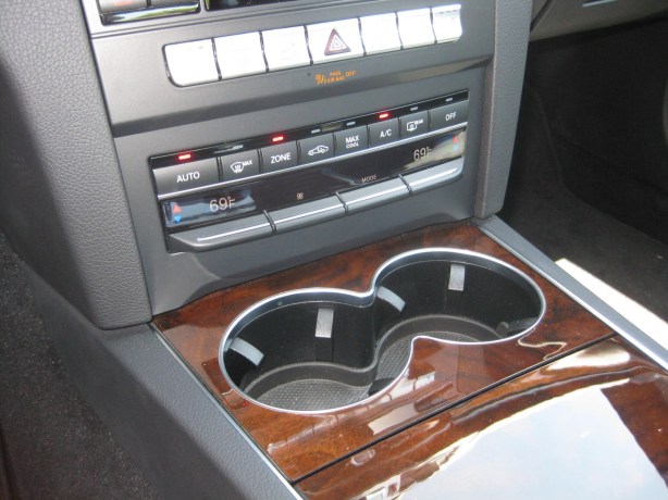 The cup holders are very poorly placed. Almost any cup will block a whole host of buttons and displays.  I think the message is don't bring drinks into this lovely cabin. The German overlords disapprove of eating in your car.
