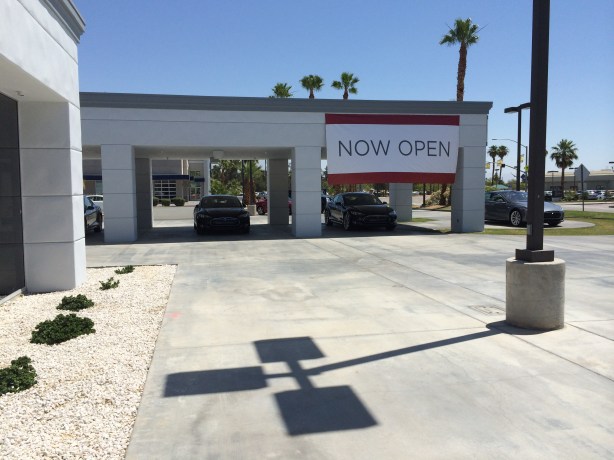 You can't miss the "Now Open" sign. And lots of curious people were there to marvel at the Model S. 
