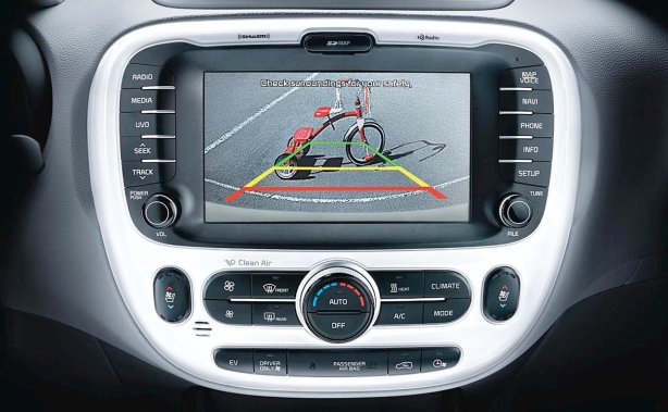 The Soul EV comes completely loaded with navigation, HD radio, SiriusXM Satellite radio and a backup camera with guides. This is the EV+ with front and rear parking sensors and ventilated front seats (note the controls). The plastic fascia is a bit cheap. 